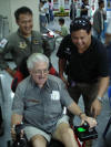 TFC General Manager Worawoot helping Papa Dave land the Bearcat at Hua Hin on the simulator at Sarex 2008