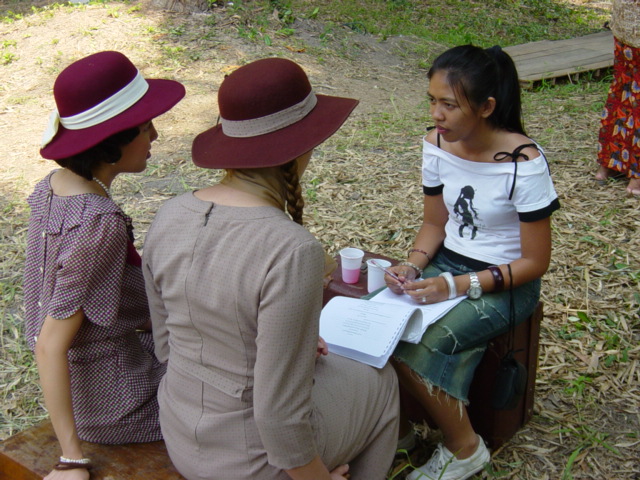 Khun F teaching French to Kanita and Sarah